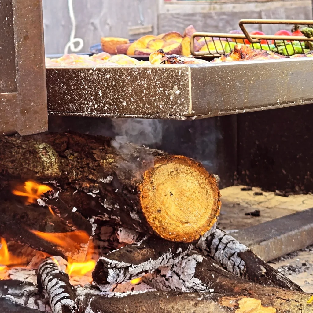 Food on wood fire grill